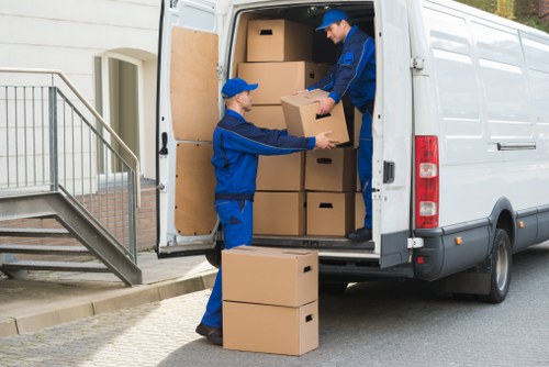Professional movers handling furniture in a Southkensington commercial property