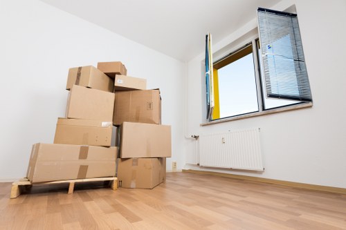 Professional movers loading household items carefully for a local relocation