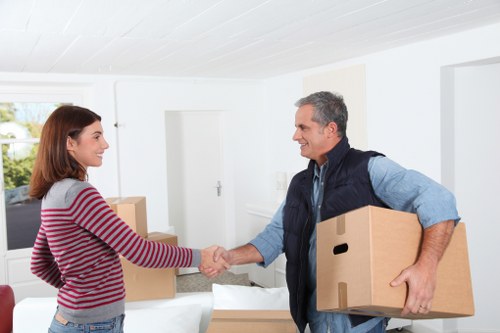 Packed moving boxes and furniture for a South Kensington home removal