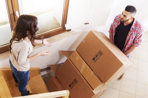 Organised moving day with boxes and furniture ready for transport