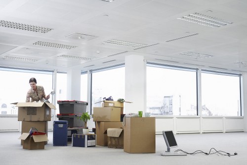 Professional movers carrying items through a South Kensington property